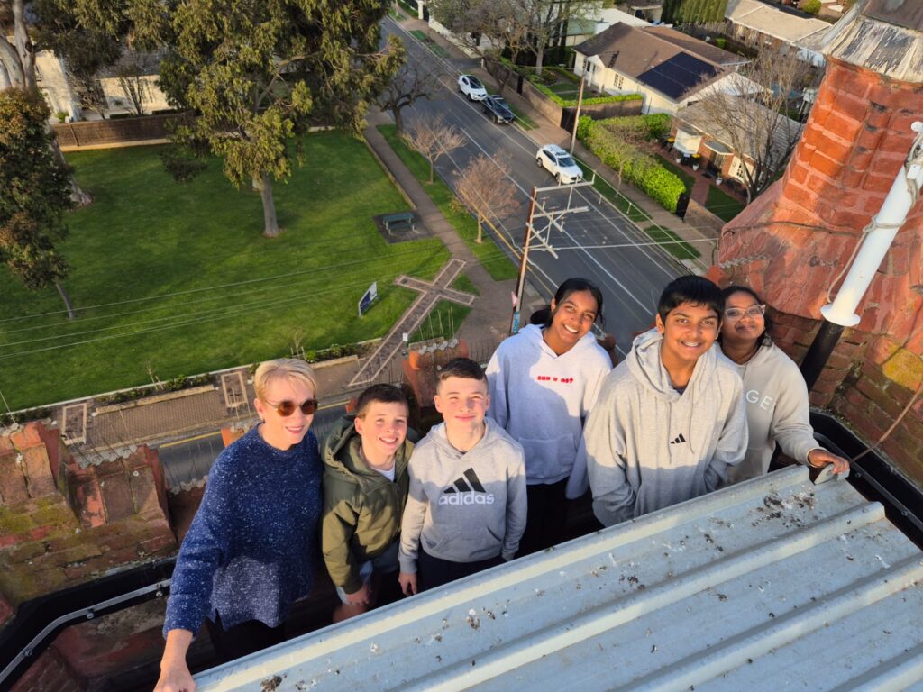 Youth Group preparing for Confirmation, pictured on top of the Church roof