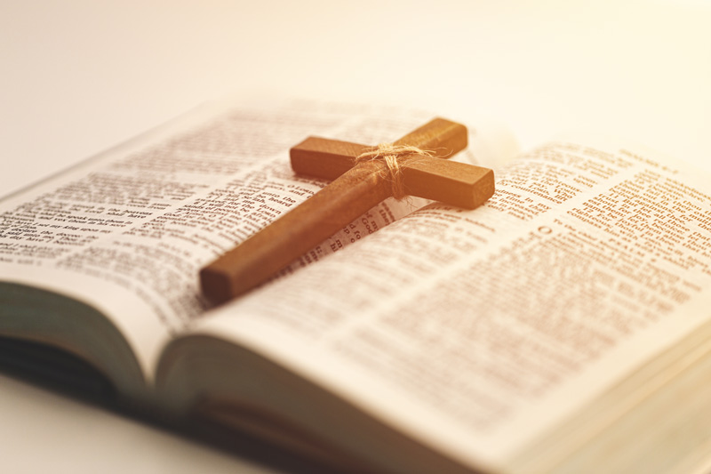 Cross on open holy bible - St Andrew's Church Walkerville
